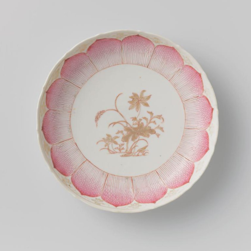 Saucer-dish with moulded petal-shaped petals, a flowering lotus and scrolls